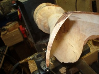 sand the interior with the lathe off