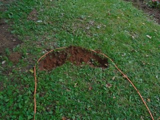 begin to dig by removing a trench of soil at one end begin to dig by removing a trench of soil at one end