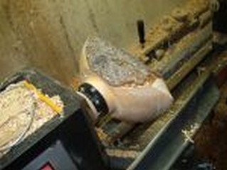 starting from the bottom to turn a natural edged bowl starting from the bottom to turn a natural edged bowl