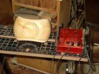 signing the bowl with a wood burner 