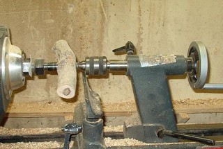 small oak log mounted on the wood lathe