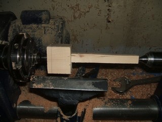 Mount it on the lathe between centers 