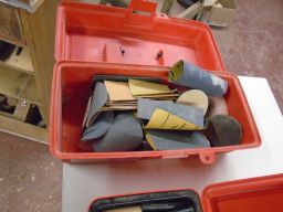 	miscellaneous disks and sheets of sandpaper.	