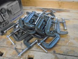 	A box of "C" clamps was found beside the workbench	