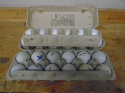 	Golf balls waiting to have their covers removed for carving.	