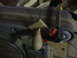 	grind a long, sharp point on the awl	